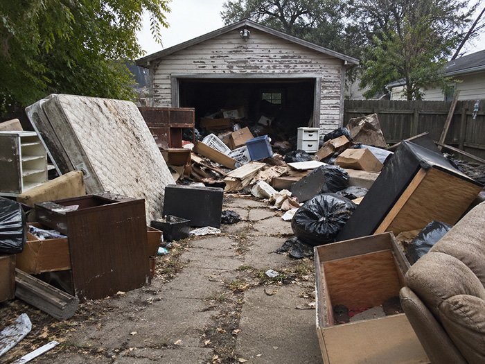 Before junk removal garage clutter
